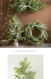 Close-up of white antlers and pine cones on a rustic Christmas wreath with eucalyptus