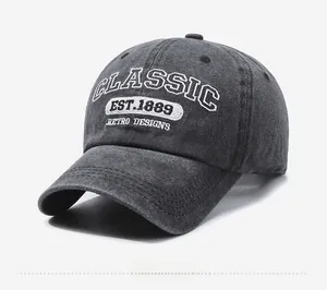 Detailed embroidery of 'CLASSIC EST.1889' on a vintage washed grey baseball cap