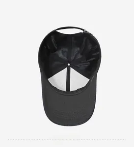 Detailed interior view of a black baseball cap featuring reinforced seams and white lining