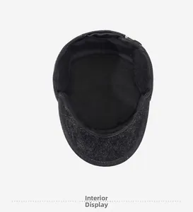 Close-up of the breathable black fabric lining and sweatband inside the winter flat cap