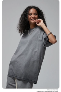 Detail view of oversized washed dark grey t-shirt and shorts set with heavy cotton texture