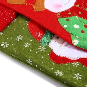 Detail view of festive Christmas stocking featuring appliqué embroidery and lockstitch edges