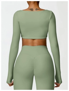Detail view of high-waisted sage green yoga set with scrunch butt lifting design