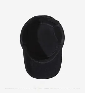 Detailed interior view of a black winter flat top hat showing clean stitching and lining