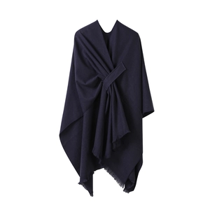 Solid navy blue cashmere-feel poncho cape with tassel edges and elegant front knot style