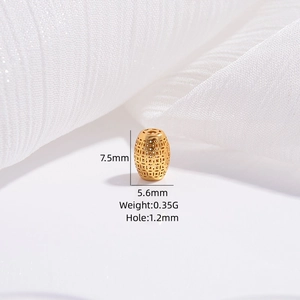 Detail view of gold hollow olive bead with dimensions 7.5mm by 5.6mm for jewelry making