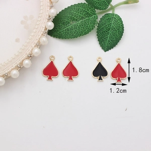 Detail of playing card spade charms showing 1.8cm by 1.2cm size measurements