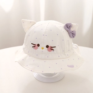 Detail of baby sun hat with cat ears, purple bow, and embroidered Hello text