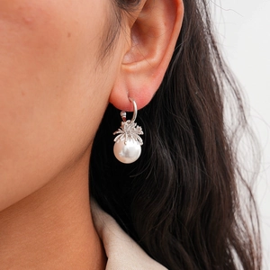 Spider pearl drop earrings with S925 silver finish on model showing gothic style details