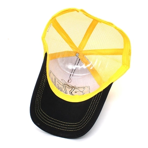 Detail of a black and yellow trucker hat showing interior stitching and mesh design