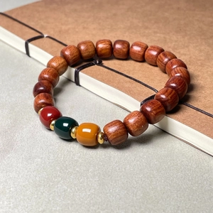 Chinese style sandalwood bracelet with red, green and yellow sugar cube beads