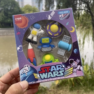 Space-themed cartoon eraser set featuring astronaut and rocket shapes in window box