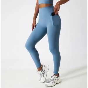 Detail view of high-waisted yoga pants featuring a functional side pocket for a smartphone