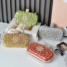 Detail of evening clutch bags with floral rhinestone patterns in green gold and silver