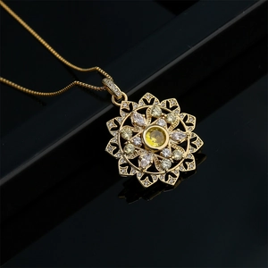 18K gold plated flower pendant necklace with yellow zircon crystals on black background