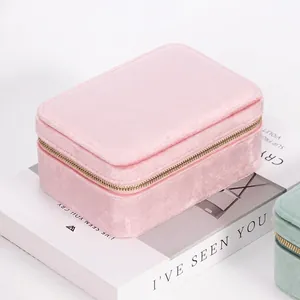 Pink velvet double layer jewelry box for girls with metal zipper on a white book
