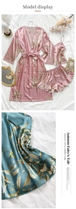 Detail of floral satin robe set with camisole and ruffled shorts in pink and teal