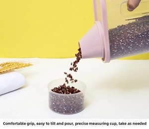 Kitchen cereal dispenser with pink lid showing pouring action and scale measurement cup