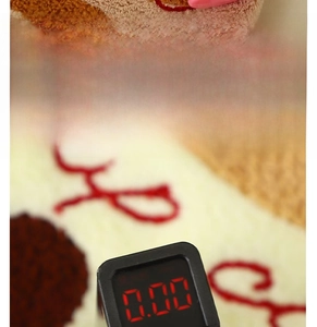 Testing equipment shows 0.00 value on coral fleece towel to prove safety and A-grade quality