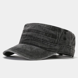 Close-up of vintage washed grey flat top military cap showing reinforced stitching detail