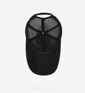 Detail view of the breathable mesh back and inner structure of the black sun hat
