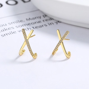 Elegant 925 sterling silver X-shaped earrings with gold plating and sparkling diamonds