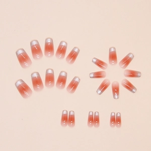 Macro detail of 24pcs reddish-brown gradient press-on nails with silver cat-eye tips