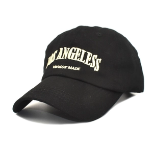 Detail of vintage washed black baseball cap with Los Angeles embroidery and cotton texture