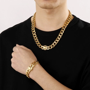 Close-up of a gold hip-hop Cuban link necklace and bracelet set with CNC diamond accents