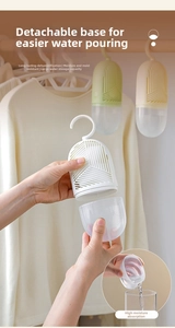 Hanging wardrobe dehumidifier detail showing easy water disposal with detachable cup