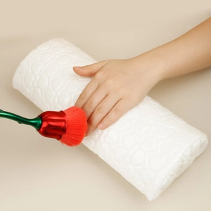 Close-up of heart-quilted white PU leather nail arm rest and rose-shaped dust brush