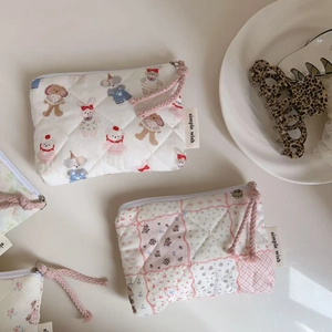 Quilted mini coin purse with cute cartoon animals and floral patterns and zipper closure