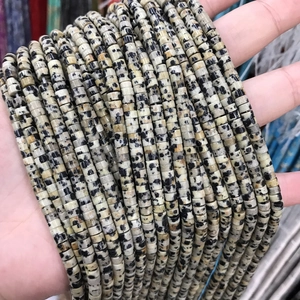 Close-up of beige Dalmatian Jasper Heishi beads strands for DIY jewelry making