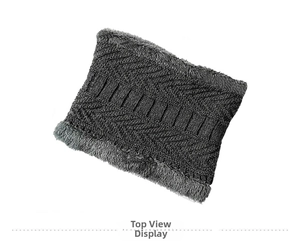 Detail of dark grey knit neck warmer featuring thick plush lining and wavy weave texture