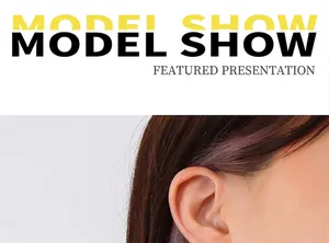 Minimalist vintage titanium steel earring shown on a model with long brown hair