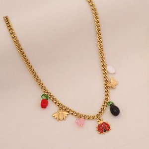Detail of gold chain necklace featuring bee, butterfly, ladybug and heart charms