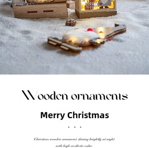 Close-up of LED glowing wooden Santa snow house ornament with warm lighting and faux fur