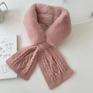 Close-up of pink faux fur and knitted scarf texture on a cozy winter display