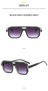 Detail view of double-bridge aviator sunglasses with black gray frames and gradient lenses
