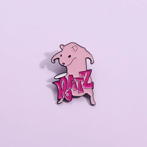 Detailed macro view of the pink enamel rat brooch with stylized RATZ text engraving