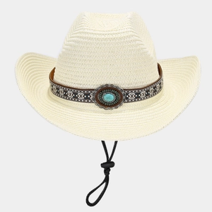 Detail of cream straw cowboy hat with ethnic turquoise stone band and adjustable chin strap