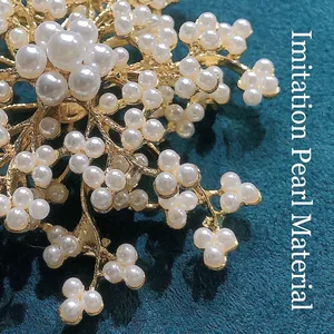 Elegant gold snowflake brooch with pearls for winter coats and formal dresses