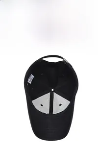 Detailed view of the black cotton baseball cap interior with white lining and metal buckle