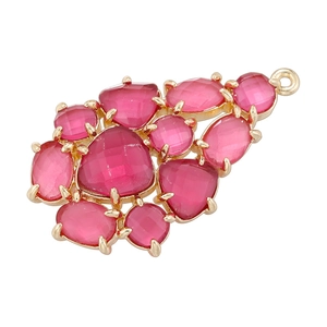 Detail of gold pendant with pink teardrop gemstones and elegant claw setting on white background