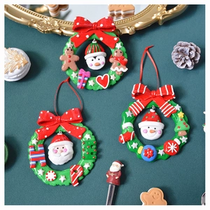 Detail view of colorful Christmas tree ornaments with Santa Claus and snowman motifs