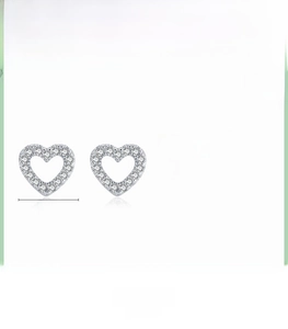 Detail view of heart-shaped S925 sterling silver stud earrings with cubic zirconia
