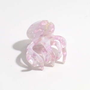 Detail of pink and purple marble gradient claw clip with smooth acetic acid finish