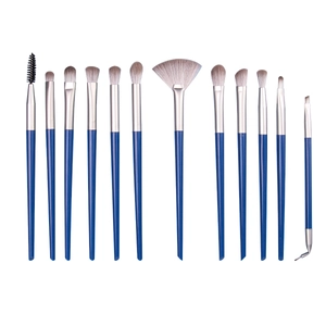 Professional 12-piece blue eye makeup brush set with synthetic bristles on white background