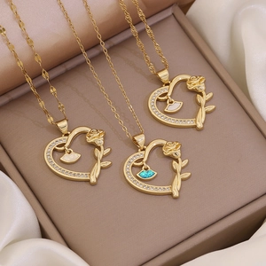 18K gold heart necklaces with rose motif and opal-like white and blue shell inlays