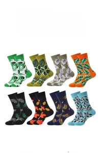 Macro detail of eight different mid-calf cotton socks with vibrant leaf and floral patterns